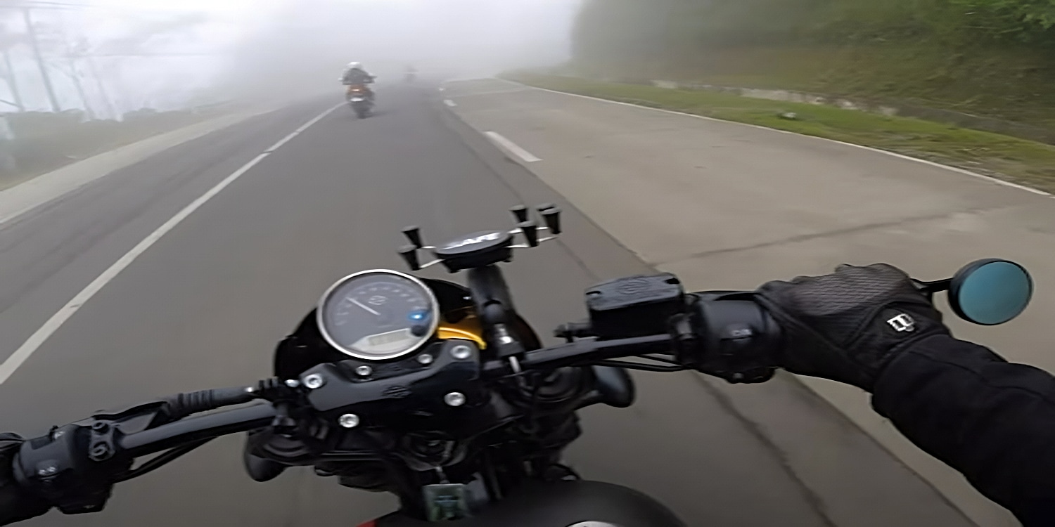 Motorcycling on a section of the 94th in Chicago near Waukegan on your way to Milwaukee along the shores of Lake Michigan at crack of dawn. The area sees the dense advection fog, which forms when warm moist winds blowing over cold lake waters cools to form a saturated air mass. Lake breezes now transport the foggy air ashore, resulting in early mornings or late evenings like this when visibility is poor. In the evenings, the problem is compounded by the setting sun with weaker rays and refraction in the atmosphere with dust and debris kicked up by vehicles. Glare from oncoming traffic does not help the situation either, especially when it comes to the safest time to ride a motorcycle. 