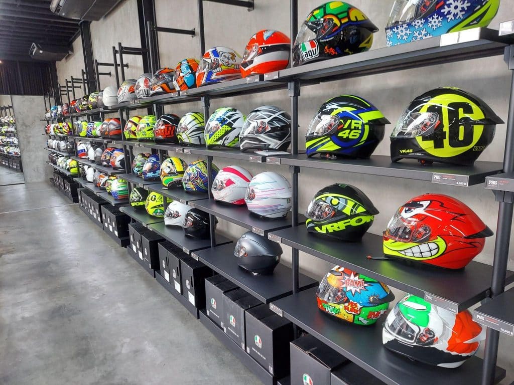 Genuine AGV helmets beautifully displayed at the authorized AGV retailer, 786 Moto Group Co., in Bangkok, Thailand.