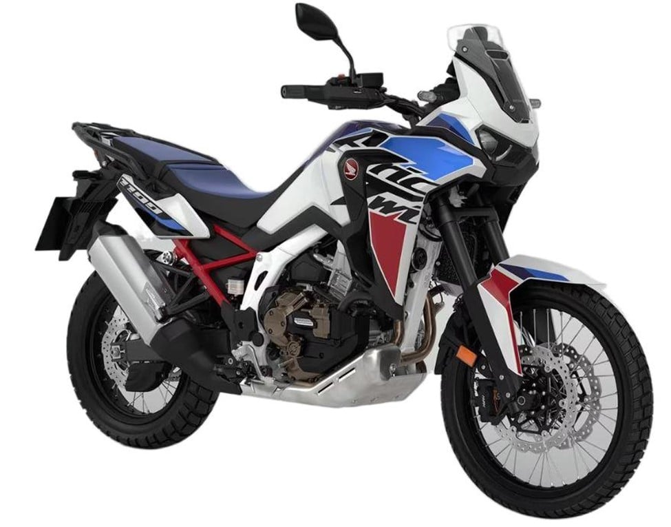 The red, white, and blue 2024 Honda Africa Twin is equipped with an upswept double flow muffler and a titanium polished sleeve. Although the factory exhaust may sound a bit dull, there are a few aftermarket options available, ranging from the Explorer II Muffler to the Rally Raid Titanium.