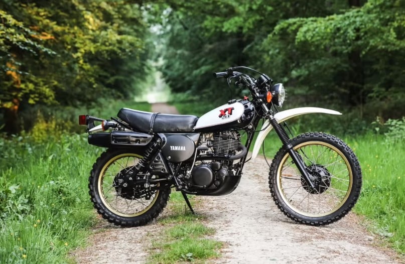 The Yamaha XT500, a rugged single-cylinder enduro-adventure motorcycle with twin-valve technology, was proudly crafted by Yamaha, gracing the roads from 1975 to 1989.