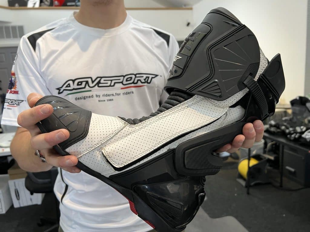 Close-up of the interior of an AGVSPORT Monza Race Boot, featuring a sticker displaying the EU 42 boot size among other details.