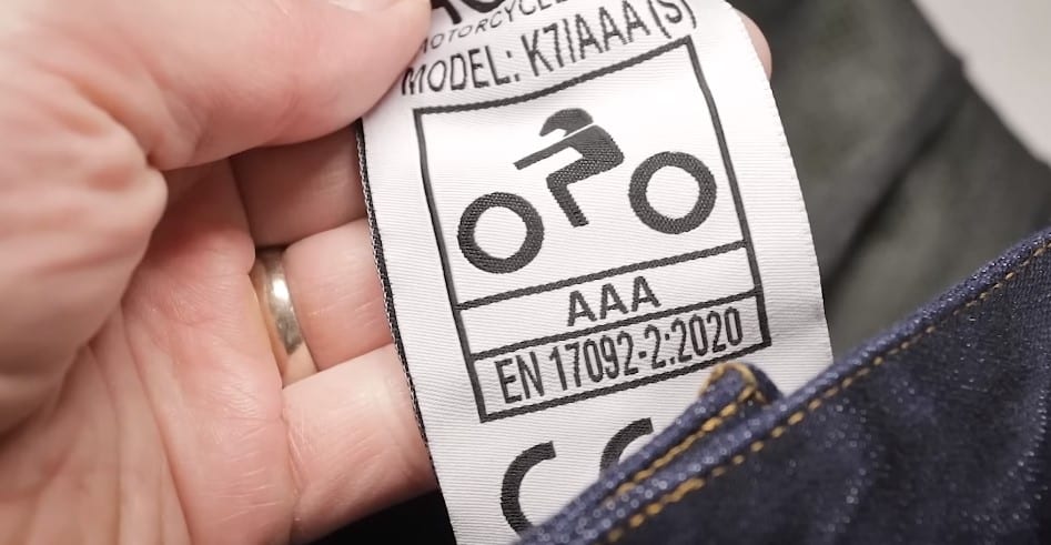 A logo on motorcycle jeans displaying the EN 17092-2:2020 standard, which outlines general requirements for Class AAA protective garments for motorcyclists.